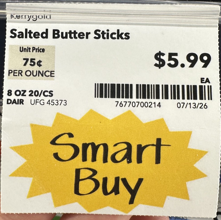A photographed grocery shelf tag: Salted Butter Sticks, $5.99, with a Smart Buy starburst